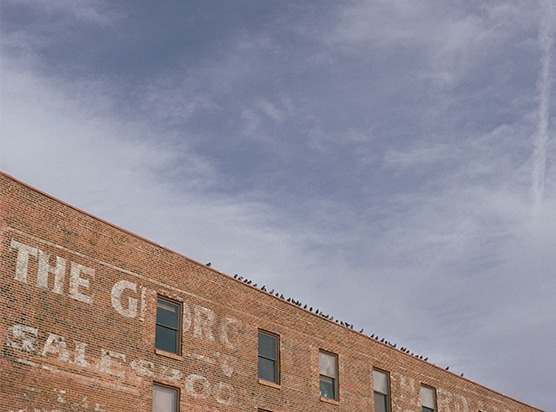 a brick building with the words the grange cafe on it