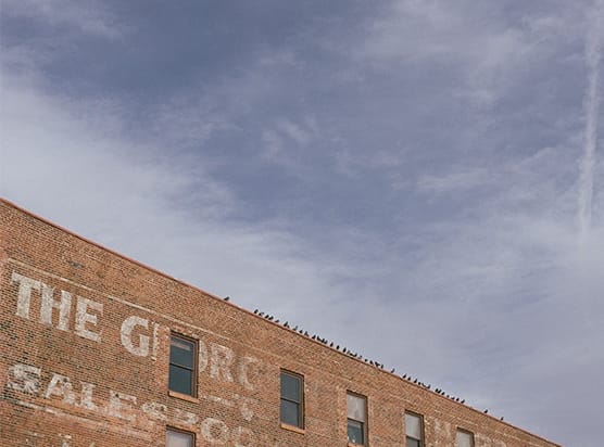 a brick building with the words the grange cafe on it