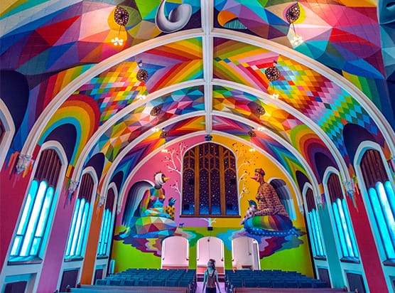 a church with a rainbow painted ceiling