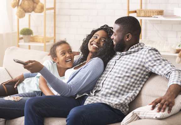 Family sitting on couch at LynnCora, Grand Prairie, 75052