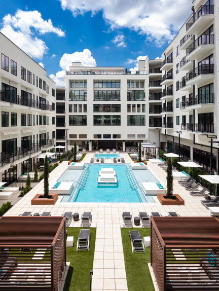 a large swimming pool in front of a building at The Deco at 5211, Atlanta, GA