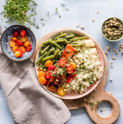 a plate of food with rice and vegetables on a table