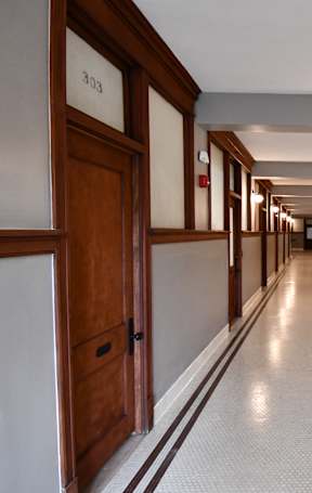 A long hallway with doors on both sides.