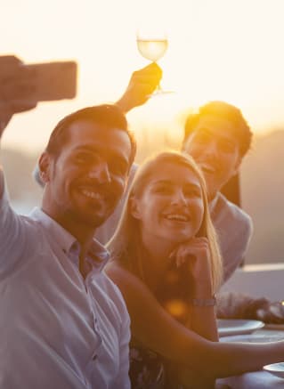 a group of people posing for a picture at a table