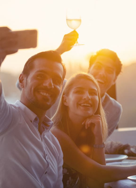 a group of people posing for a picture at a table