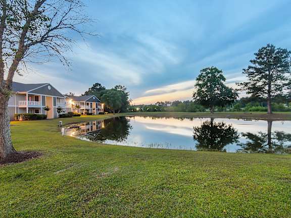 the view of a house with a pathway in front of it at The Pointe Apartment Homes, Gautier, 39553