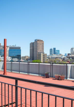the deck on the top of the building has a view of the city