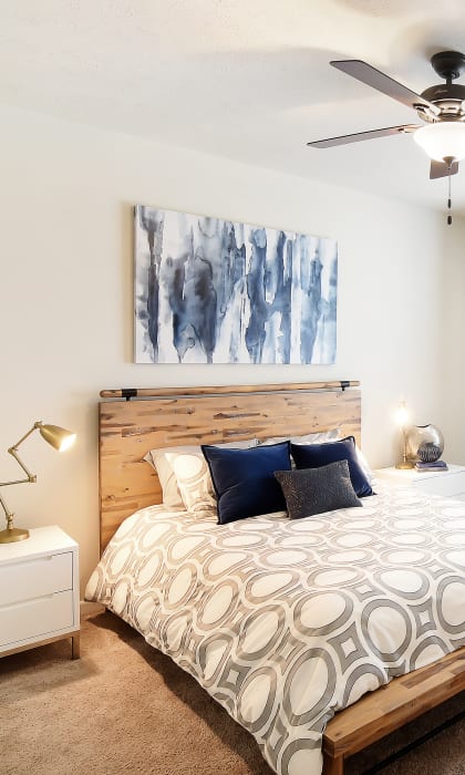 a bedroom with a bed and a ceiling fan at Landing at Willow Bayou in Bossier City, Louisiana 71111
