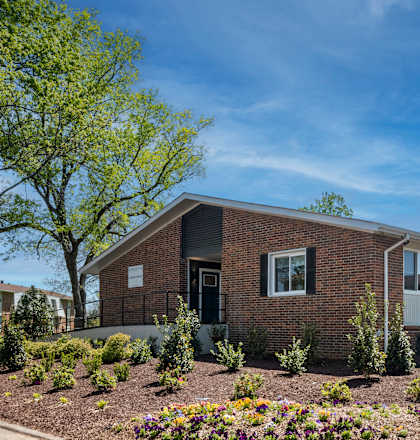 A house with a garden in front.