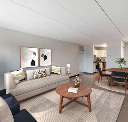 A living room with a sofa, chairs, and a coffee table.