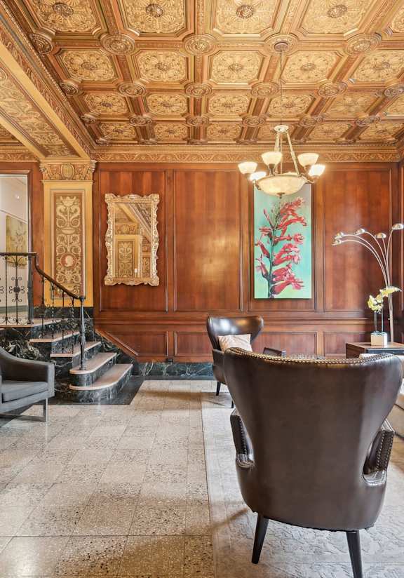 a living room filled with furniture and a ceiling fan at CWE Apartments, St. Louis, 63108