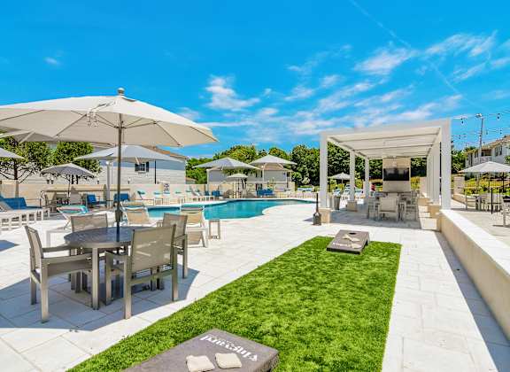 A sunny day at the outdoor pool area of a resort at The Vineyard of Olive Branch Apartment Homes, Olive Branch, 38654