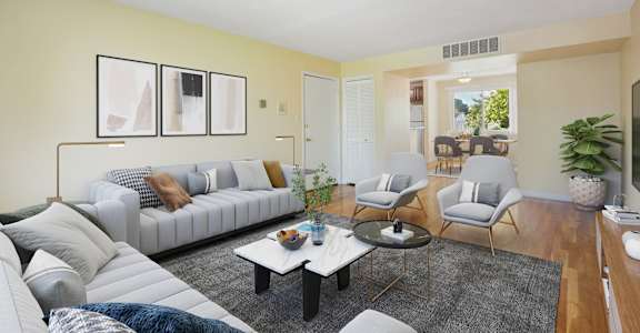 a living room with couches and chairs and a coffee table