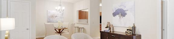 A living room with a white ceiling fan and a white couch at Summit of Shreveport Apartments, Shreveport, 71105