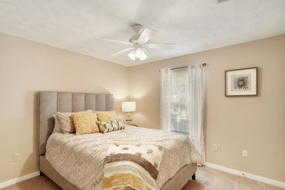 a kitchen and dining room with a table and chairs  at Parklane Apartment Homes, McComb, MS