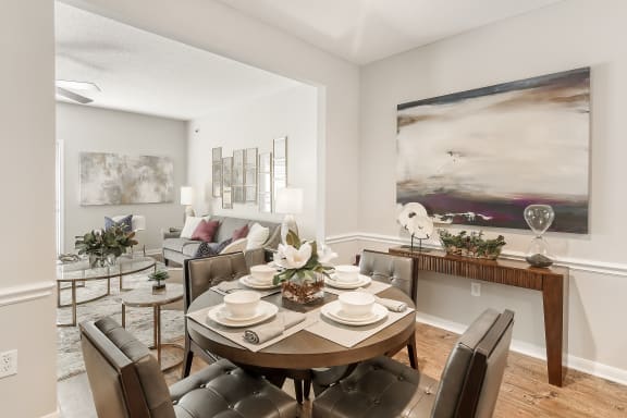 a bedroom with a bed and a ceiling fan  at Lagniappe of Biloxi Apartment Homes, Biloxi, MS
