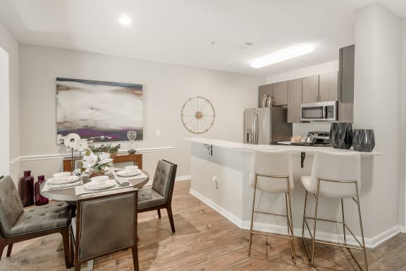 a living room with a couch and a ceiling fan  at Lagniappe of Biloxi Apartment Homes, Biloxi, MS, 39532