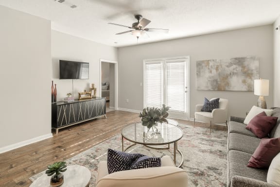 a swimming pool with chaise lounge chairs and trees in the background  at Lagniappe of Biloxi Apartment Homes, Biloxi, 39532