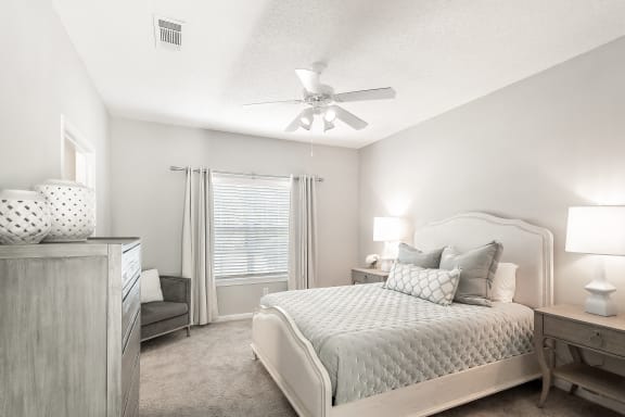 a patio with a pool and lounge chairs  at Lagniappe of Biloxi Apartment Homes, Biloxi, 39532