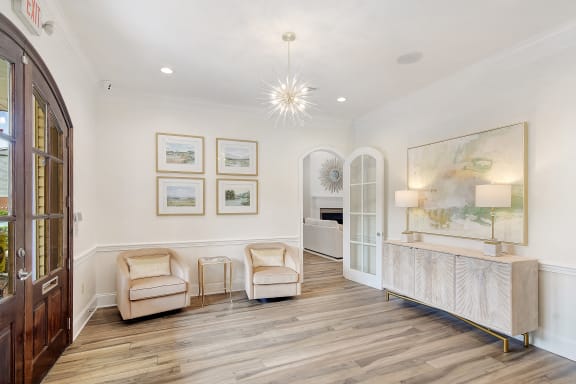 a living room and dining room with a table and chairs at Summit of Shreveport Apartment Homes, Louisiana, 71105