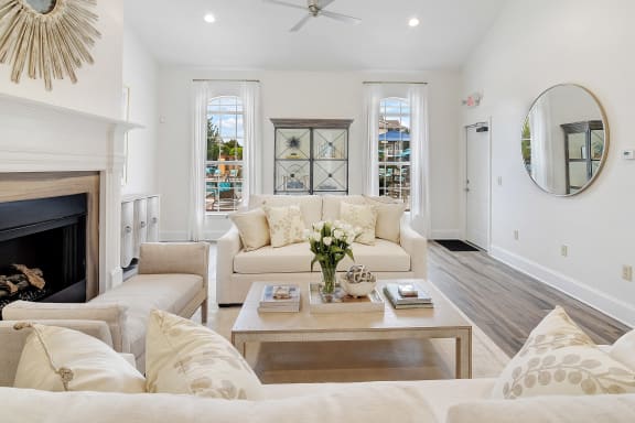 a living room with white furniture and a mirror at Summit of Shreveport Apartment Homes, Shreveport, LA, 71105