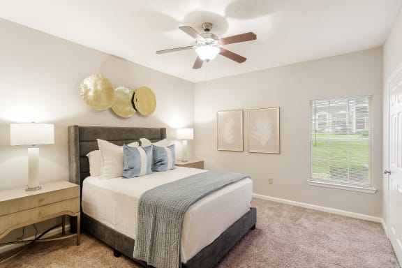 a swimming pool with chaise lounge chairs and a pool house in the background at Highpointe Apartment Homes, Mississippi, 39042