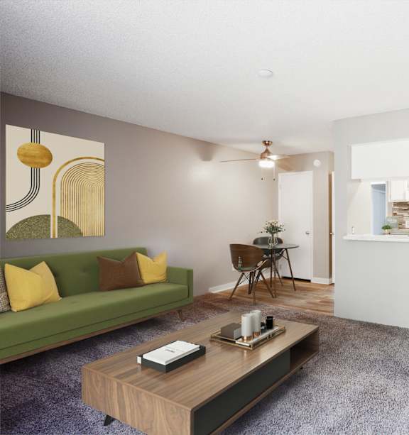 A living room with a green couch and a wooden coffee table.