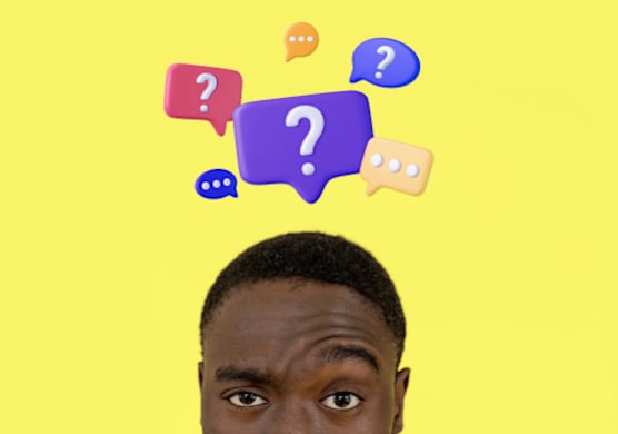 A person with a yellow background and colorful speech bubbles with question marks.