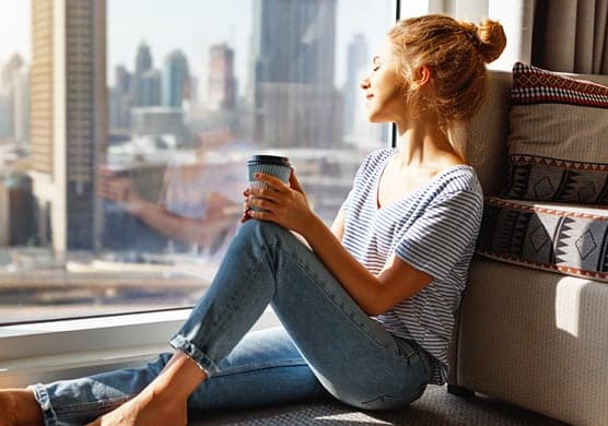 Girl Drinking Coffee at The Santal, Austin, TX, 78735