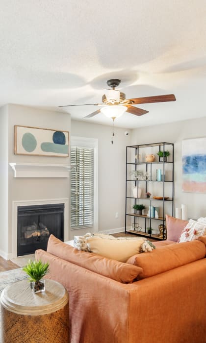 a living room with a couch and a ceiling fan at Reserve of Jackson Apartment Homes, Jackson, MS 39211