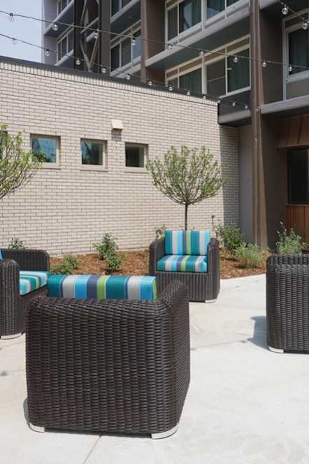 A patio with a table and chairs.