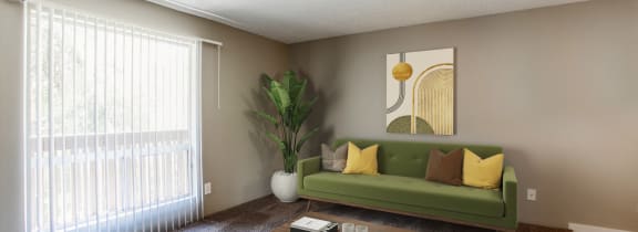 a living room with a couch and a table and a fireplace