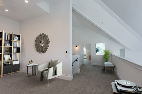 a living room with a couch and a table at Vendome Place, California