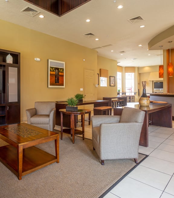 a living room with couches and chairs and a television