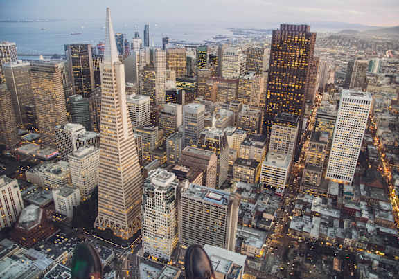 A cityscape with a mix of modern and older buildings.