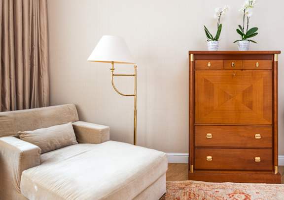 a living room with a couch and a dresser