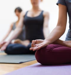a group of women in a yoga class