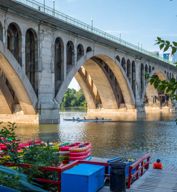 a bridge over a river with a boat under it