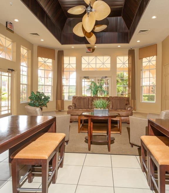 a living room with couches and chairs and a television