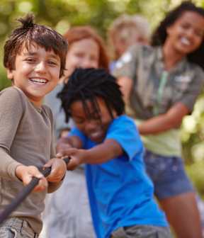A group of children playing tug of war at Victory Northgate Apartments, Seattle, 98125