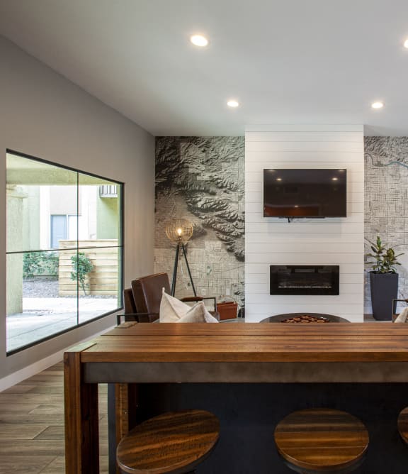 a dining room with a table and chairs and a fireplace