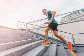 a man running up a flight of stairs