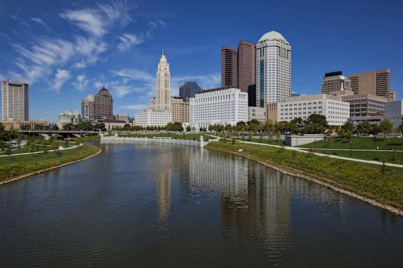 A city skyline with a large body of water in the foreground.