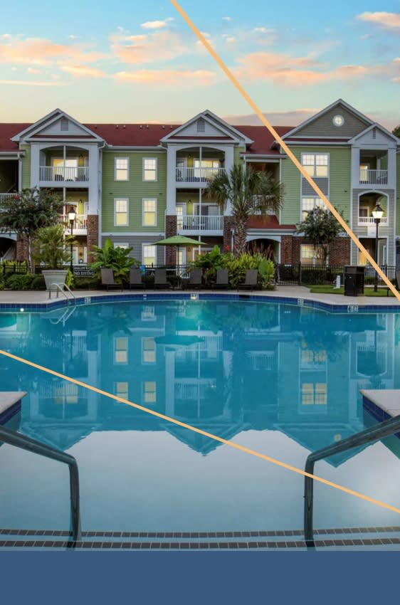 a large pool with a building in the background at Breakers Point, South Carolina, 29579