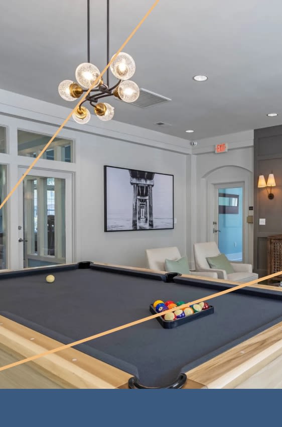 a pool table in a living room with a lamp at Breakers Point, South Carolina, 29579