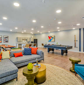A room with wooden floors and white walls.at Hawthorne Pointe, Bondurant, IA
