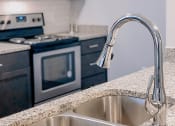 Thumbnail 29 of 44 - Sink With Faucet In Kitchen at The Ivy at Berlin Place, South Bend, IN, 46601