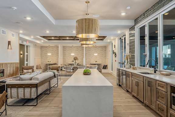 A modern kitchen with a large island in the center.