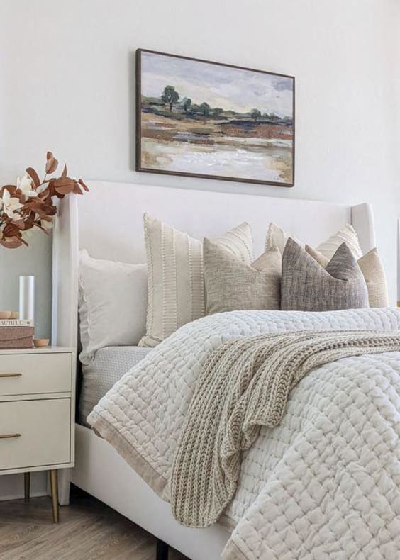a white bedroom with a bed and a coffee table at 2000 Oasis  Apartments, Atlanta, GA