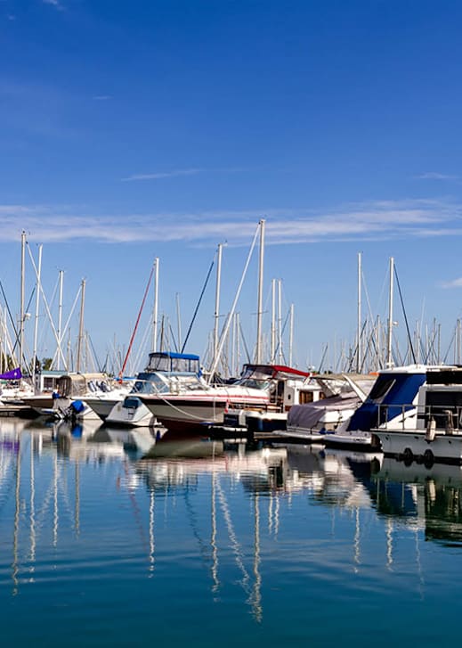 A marina filled with boats on a sunny day.